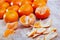 Closeup of fresh peeled clementines on wooden table