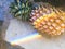 Closeup of fresh pineapple with rainbow prism light