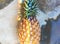 Closeup of fresh pineapple with rainbow prism light