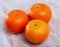 Closeup of fresh sweet clementines on wooden table