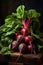 closeup freshly collected farmers natural red ripe beets with tops on a wooden board