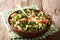 Closeup of freshly made homemade shirazi salad of cucumbers, tomatoes, onions and herbs in a bowl. horizontal