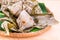 Closeup on freshly steamed Chinese rice dumpling on traditional rattan tray