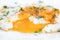 Closeup, fried egg with fluidly and liquid egg yolk on a white p