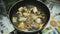 Closeup of fried pork chops in the frying pan on the stove