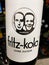 Closeup of Fritz-Kola bottle hold by hand in german supermarket