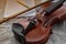 Closeup front side of violin put on grunge surface background,show detail of acoustic instrument