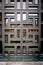 Closeup front view of a beautiful vintage ornate steel brass door with glass and square pattern.