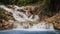 closeup front view of waterfalls cascade of mountain stream