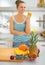 Closeup on fruits on table and young woman in back