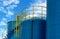 Closeup fuel storage tank in petroleum refinery. Blue big tank of oil storage. Fuel silo. Liquid petroleum tank. Petroleum oil