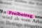 Closeup of the german word Freibetrag written in bold font and highlighted with a pink marker