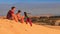 Closeup Girl Climbs up White Sand Dune Crest