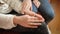 Closeup of girl stroking and consoling her friend by hand. Friends support and teenager depression