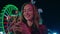Closeup girl typing smartphone at illuminated ferris wheel. Happy model send