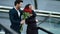 Closeup girl waiting for boyfriend. Man surprising girlfriend with red roses