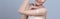 Closeup glamorous woman applying moisturizer cream on her arm for perfect skin