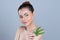 Closeup glamorous woman hold green leaf as cannabis beauty concept.