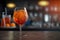 Closeup glass of aperol spritz cocktail decorated with orange at bar background. AI Generation