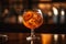 Closeup glass of aperol spritz cocktail decorated with orange at bar background. Generative AI