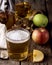 Closeup of a Glass of Cider with Ripe Apples Wooden Background Vertical