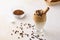 Closeup of a glass of Dalgona coffee on the table with chocolate chips on it