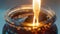 A closeup of a glass jar filled with a dark viscous liquid with a small flame burning at the top. This represents the