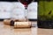 Closeup glass of red wine on background of bottles, corks. Concept wine Burgundy, Tuscany, Bordeaux, professional vertical tasting