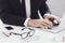 Closeup of Glasses. Businessman Working in Office