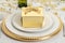 Closeup gold gift with table setting