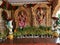 Closeup of Golden Color Lord Venkateshwara and his wife Goddess Lakshmi Statue at the entrance of Wedding Hall or Kalyana Mantapa