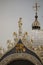 Closeup of the golden and luxury rooftop details of St Marks Basilica in Venice