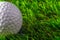 Closeup golf ball on grass