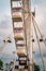 Closeup on gondolas of illuminated cantilevered observation wheel