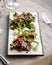 Closeup gourmet appetizer beet salad with cheese