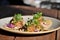 Closeup of Gourmet seafood tacos on a wooden table