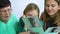 Closeup of grandmother showing old photo album to her granddaughters