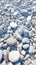 Closeup gray pebbles scattered on a peaceful beach