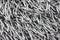 Closeup of gray silver shag material - almost monotone backgroun