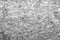 Closeup grayscale texture of wood chipboard pattern