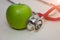 Closeup of green apple and a stethoscope healthy food and concept for diet, Healthcare, Nutrition or medical insurance. Fruit,