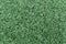 Closeup green bitumen shingle. Rough background