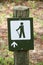 Closeup of a green hiking trail sign