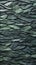 Closeup of a green stone wall with fish scales and folds in the