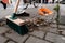 Closeup of a green street broom used in cleaning a cobblestone street