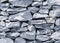 Closeup grey stone stack wall background