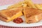 Closeup grilled cheese with ketchup focus on ketch