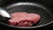 Closeup of grilled steak texture being cooked.