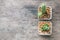 Closeup group of cactus in plastic white pot on wood desk textured background in top view with copy space