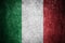 Closeup of grunge Italian flag. Dirty Italy flag on a metal surface